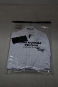 A women's as new Pas Normal Mechanism cycling jersey in white (XS - RRP £155).