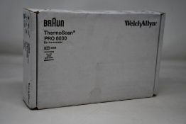A Braun ThermoScan Pro 6000 ear thermometer.