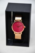 A women's as new Coluri Pankhurst watch in scarlet (RRP £139).