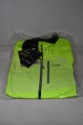 An as new Gore Gore-Tex Paclite jacket in neon yellow (L).