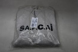 An as new A.P.C. x Sacai Taiyo hoodie in grey (M).
