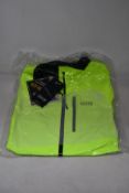An as new Gore Gore-Tex Paclite jacket in neon yellow (L).