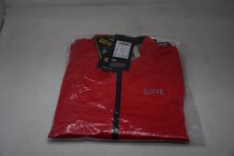 An as new Gore C5 Gore-Tex Active jacket in red (M).