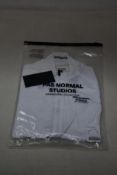 A women's as new Pas Normal Mechanism cycling jersey in white (M - RRP £155).
