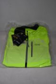 An as new Gore Gore-Tex Paclite jacket in neon yellow (L).