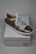 A pair of as new Guinea Camden bronze low top trainers (EU 41).