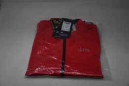 An as new Gore C5 Gore-Tex Active jacket in red (M).