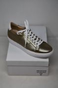 A pair of as new Guinea Camden bronze low top trainers (EU 41).