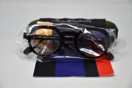 A pair of as new Anne & Valentin glasses frames with case.