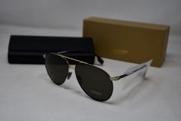 A pair of as new Burberry sunglasses.