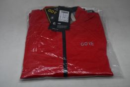 An as new Gore C5 Gore-Tex Active jacket in red (S).
