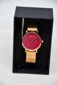 A women's as new Coluri Kahlo watch in scarlet (RRP £139).