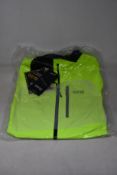 An as new Gore Gore-Tex Paclite jacket in neon yellow (L).