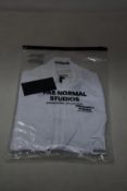 A women's as new Pas Normal Mechanism cycling jersey in white (XS - RRP £155).