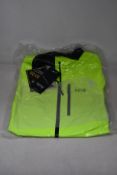An as new Gore Gore-Tex Paclite jacket in neon yellow (L).