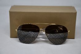 A pair of as new Burberry sunglasses.
