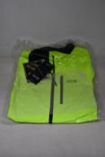 An as new Gore Gore-Tex Paclite jacket in neon yellow (L).