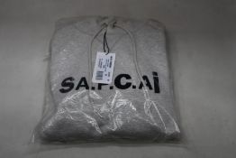 An as new A.P.C. x Sacai Taiyo hoodie in grey (M).