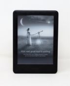 A pre-owned Kindle (10th Gen) in Black (Some cosmetic marks to casing).