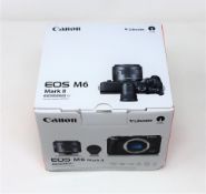 A boxed as new Canon EOS M6 Mark II camera kit with EF-M 15-45mm lens (box damaged).