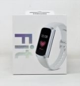 A boxed as new Samsung Galaxy Fit Fitness Tracker in Silver (Box sealed).