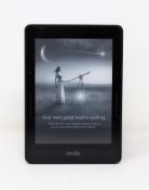 A pre-owned Kindle Voyage (7th Gen) in Black (Some cosmetic marks to rear casing).