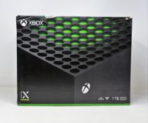 A pre-owned boxed Xbox Series X (1TB) games console in black (console only - no controller or