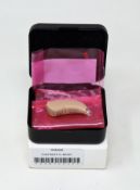 An as new Signia Contrast S+ Hearing Aid in Beige (REF: 10949268).