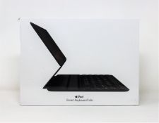 A boxed as new Apple iPad smart keyboard folio for iPad Pro 11-inch in grey/black (PN: MXNK2B/A)
