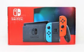 A boxed as new Nintendo Switch Console in Neon Red/Blue (M/N: HAD-S-KABAA-JPN) (Some packaging