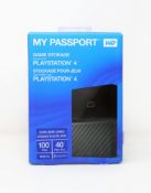 A boxed as new Western Digital 4TB My Passport portable gaming drive for PlayStation 4 in black.