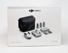A boxed as new DJI Mini 2 Drone Fly More Combo Kit (UK model) (Box sealed).