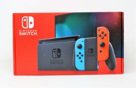 A boxed as new Nintendo Switch Console in Neon Red/Blue (M/N: HAD-S-KABAA-JPN) (Some packaging