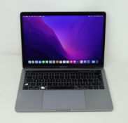 A pre-owned touchbar Macbook Pro (13-Inch, 2019, Four Thunderbolt 3 Ports) with 2.4GHz Quad-Core