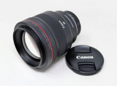 A boxed as new Canon RF 85mm F1.2L USM DS Lens with Lens Case and Lens Hood.