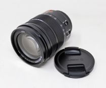 A boxed as new Panasonic Leica DG Vario-Elmarit 12-60mm f/2.8-4.0 ASPH. Power O.I.S. Lens.