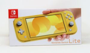 A boxed as new Nintendo Switch Lite Console in Yellow (M/N: HDH-S-YAZAA-JPN) (Some packaging text in
