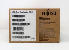 A boxed as new Fujitsu PR09 USB port replicator / dock in black (box opened).