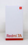 A boxed as new Xiaomi Redmi Redmi 7A 2GB/32GB in Gem Blue (Box opened. Two pin plug).