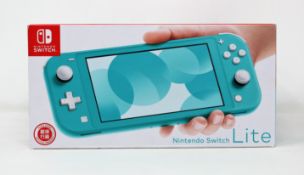 A boxed as new Nintendo Switch Lite Console in Turquoise (M/N: HDH-S-BAZAA-HKG) (Some packaging text