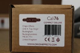 A boxed as new Origin Effects Origin Cali76 Compact Deluxe Compressor.