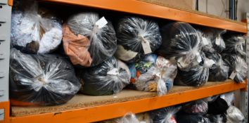 Thirteen bags of assorted pre-owned clothing and related items.