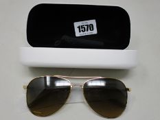 A pair of as new Calvin Klein sunglasses.