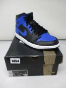 A pair of as new Nike Air Jordan 1 Mid (UK 7).
