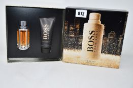 Three Hugo Boss The Scent boxed gift sets.