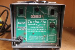 A pre-owned Turbo-Flo Fresh Air Hose Breathing Apparatus.