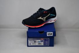 Three pairs of as new Mizuno Wave Rider 24 running trainers (UK 7).