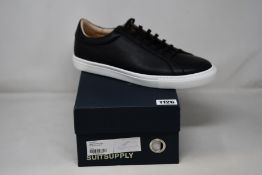 A pair of as new Suit Supply leather sneakers in black (UK 12 - RRP £149).