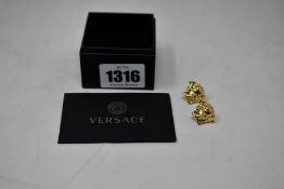 A pair of as new Versace Medusa Head earrings (Gold ton brass).