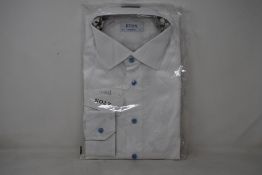 An as new Eton shirt in white (Size 17 - RRP £170).